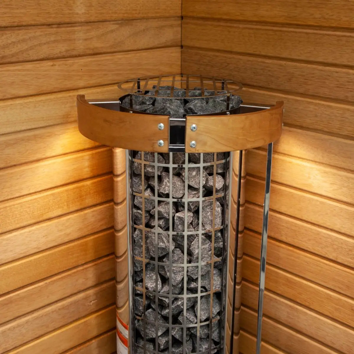 Wooden sauna heater with stones inside a wooden sauna room by Finnish Sauna Builders
