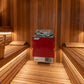 Red sauna heater in a wooden sauna room
