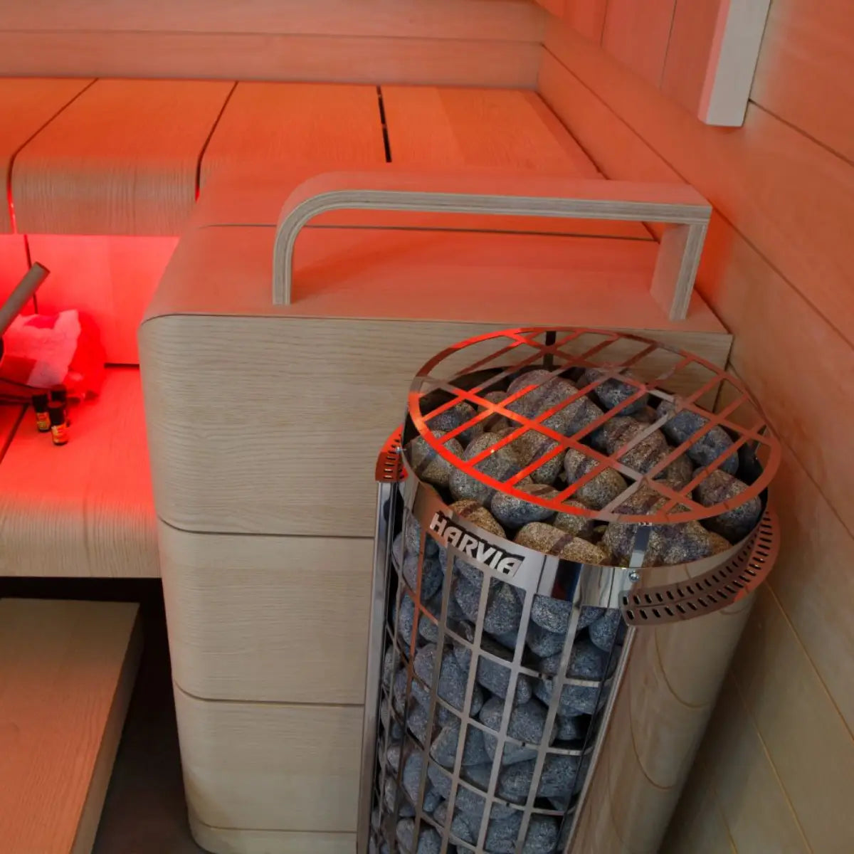 Wooden sauna bench with a heater by Finnish Sauna Builders