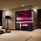 Modern bedroom with a large wardrobe and cityscape view