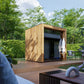 Modern outdoor cabin with wooden exterior in a lush green garden