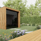 Wooden garden shed in a garden setting with a deck and flowers.